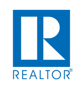 A blue and white logo for realtor. Com